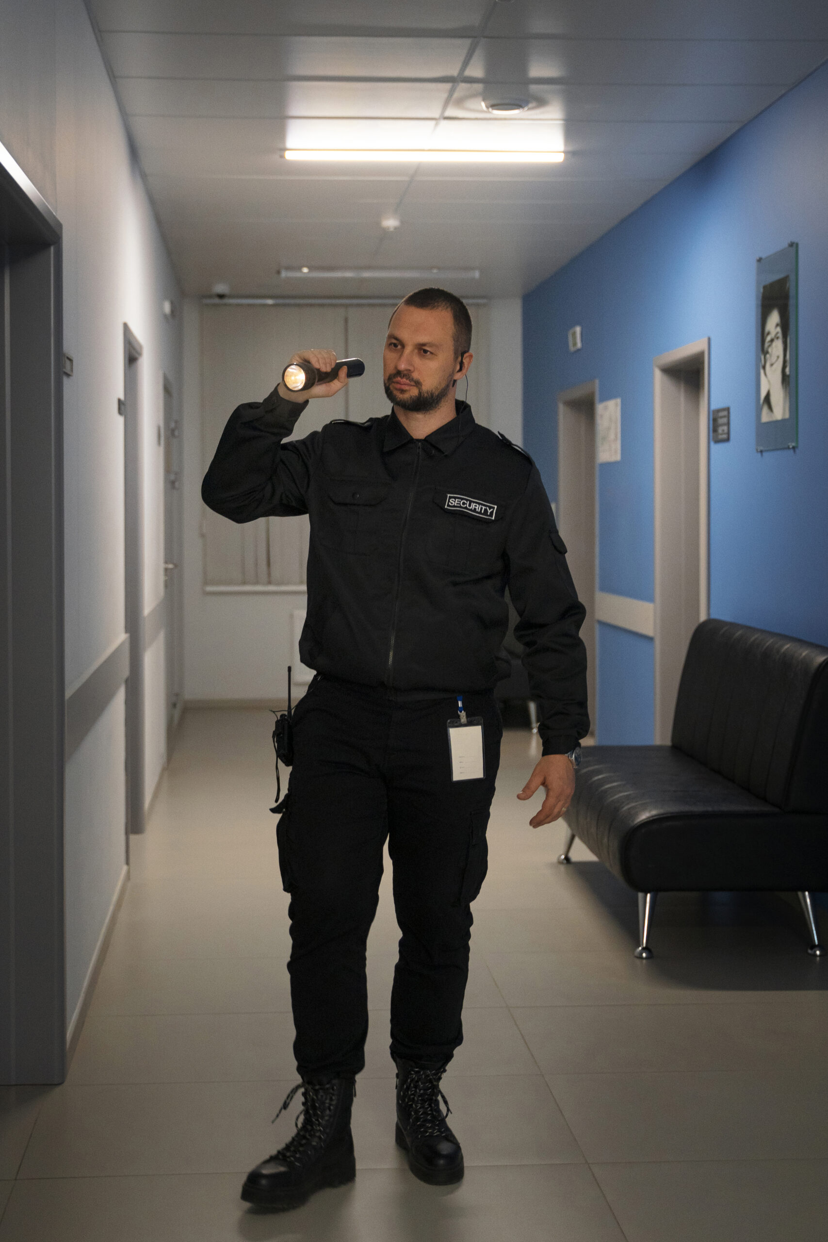Security guard standing in a modern office environment - Pro Active Solutions